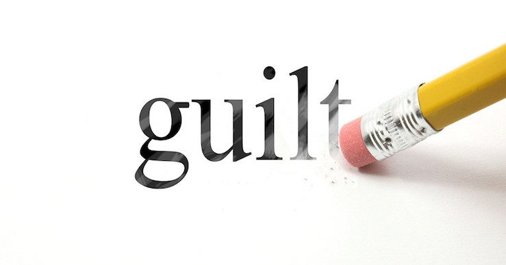 The word guilt, being rubbed away