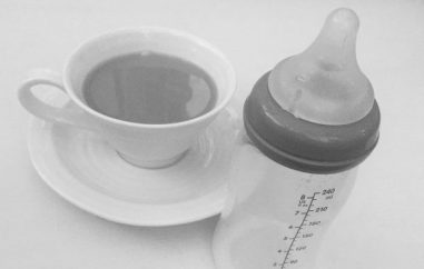 Cup of tea and baby bottle
