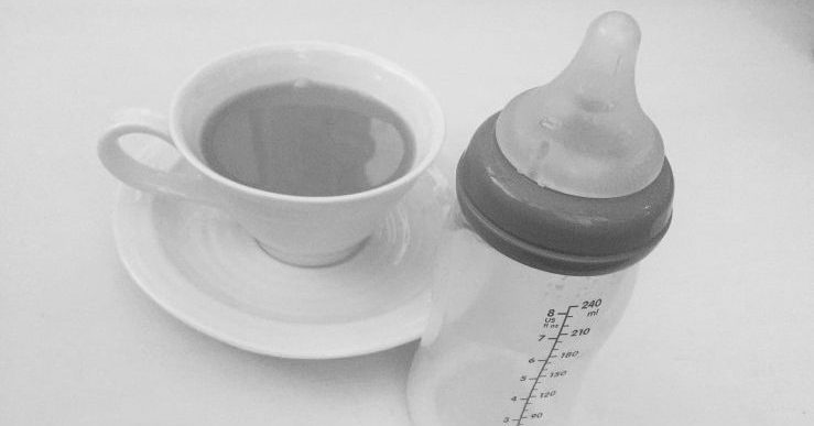 Cup of tea and baby bottle
